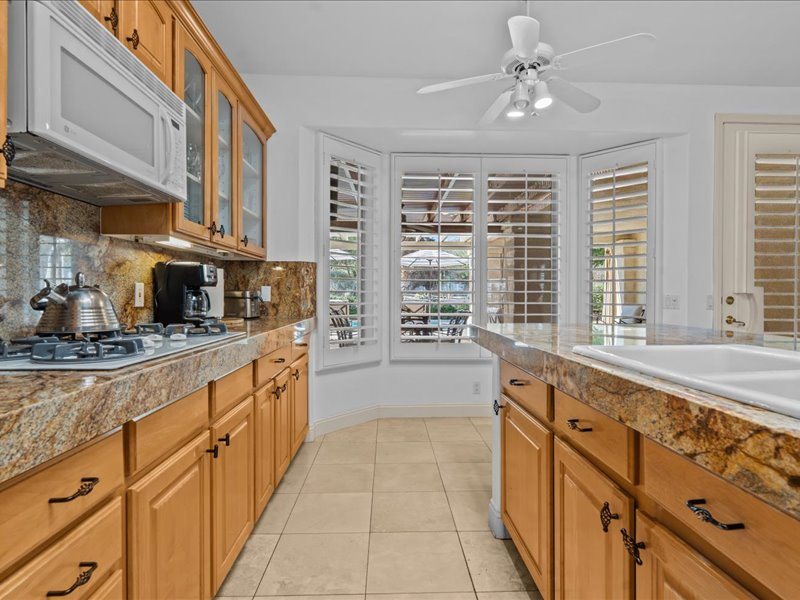 Chef's kitchen open to the family room, 71569 Sahara Road, Rancho Mirage